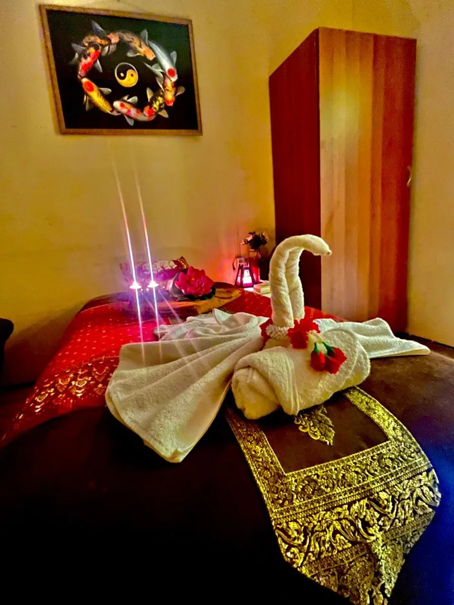 Thai massage mat room with golden curtains
